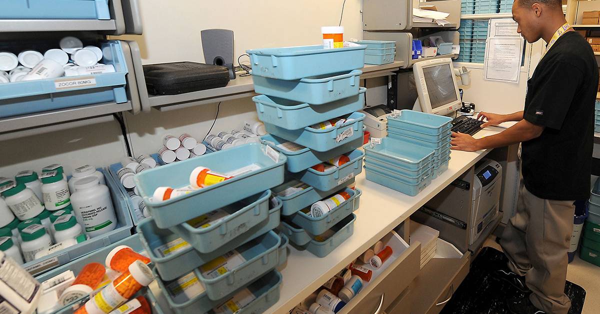 Licensed pharmacist filling prescription orders